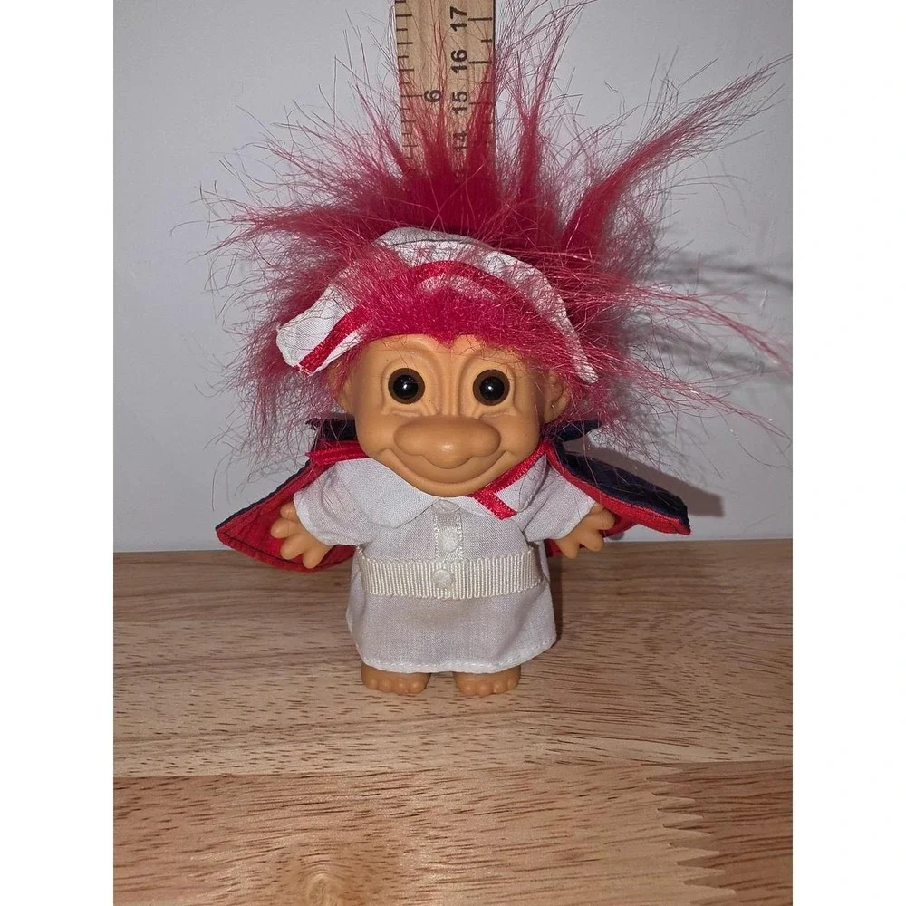 vintage Russ Berrie Florence Nightingale Nurse Troll Doll featuring bright red